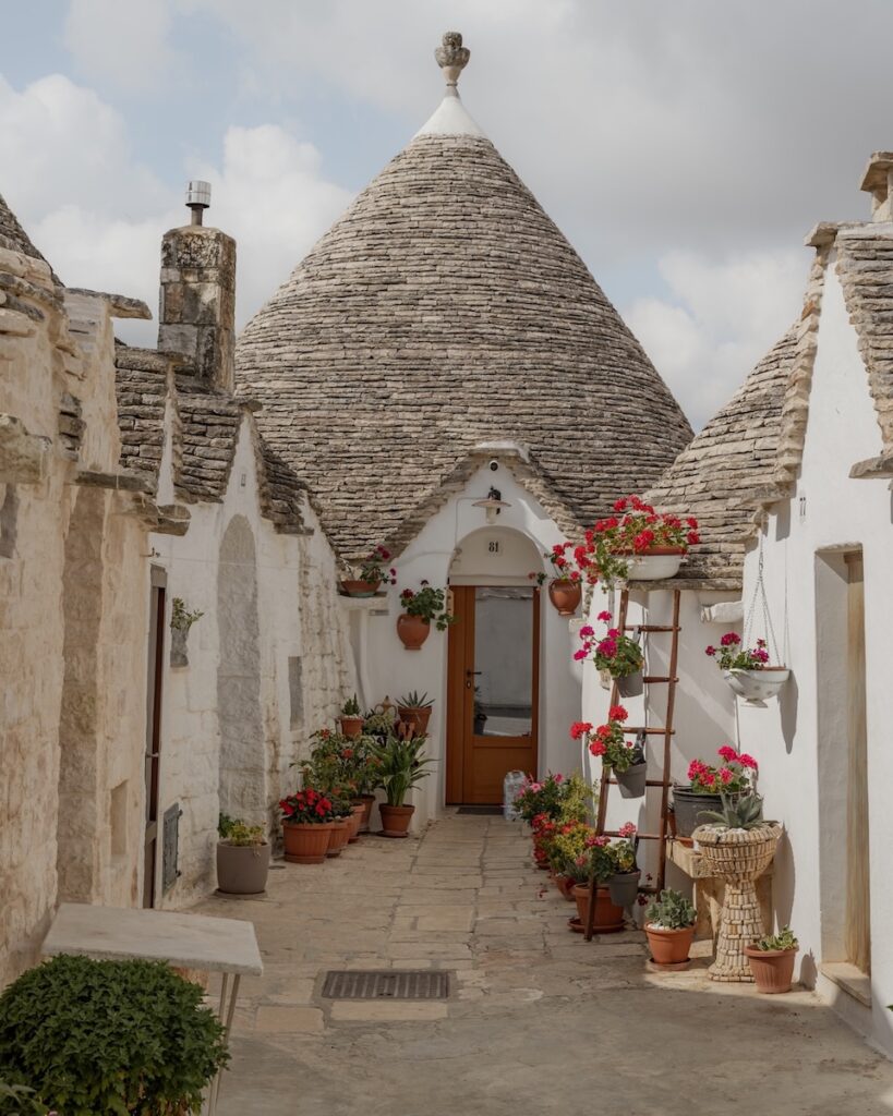 Puglia Itinerary: a trullo with flowers in front
