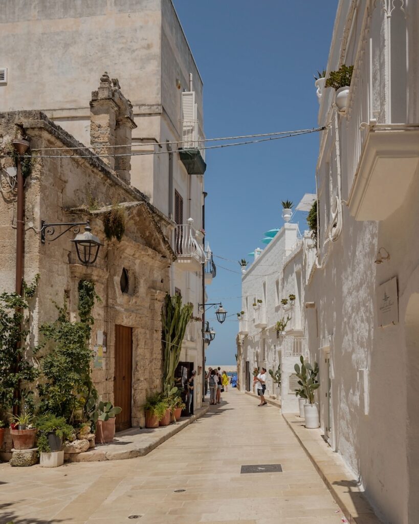 Puglia Itinerary: a street with whitewashed buildings
